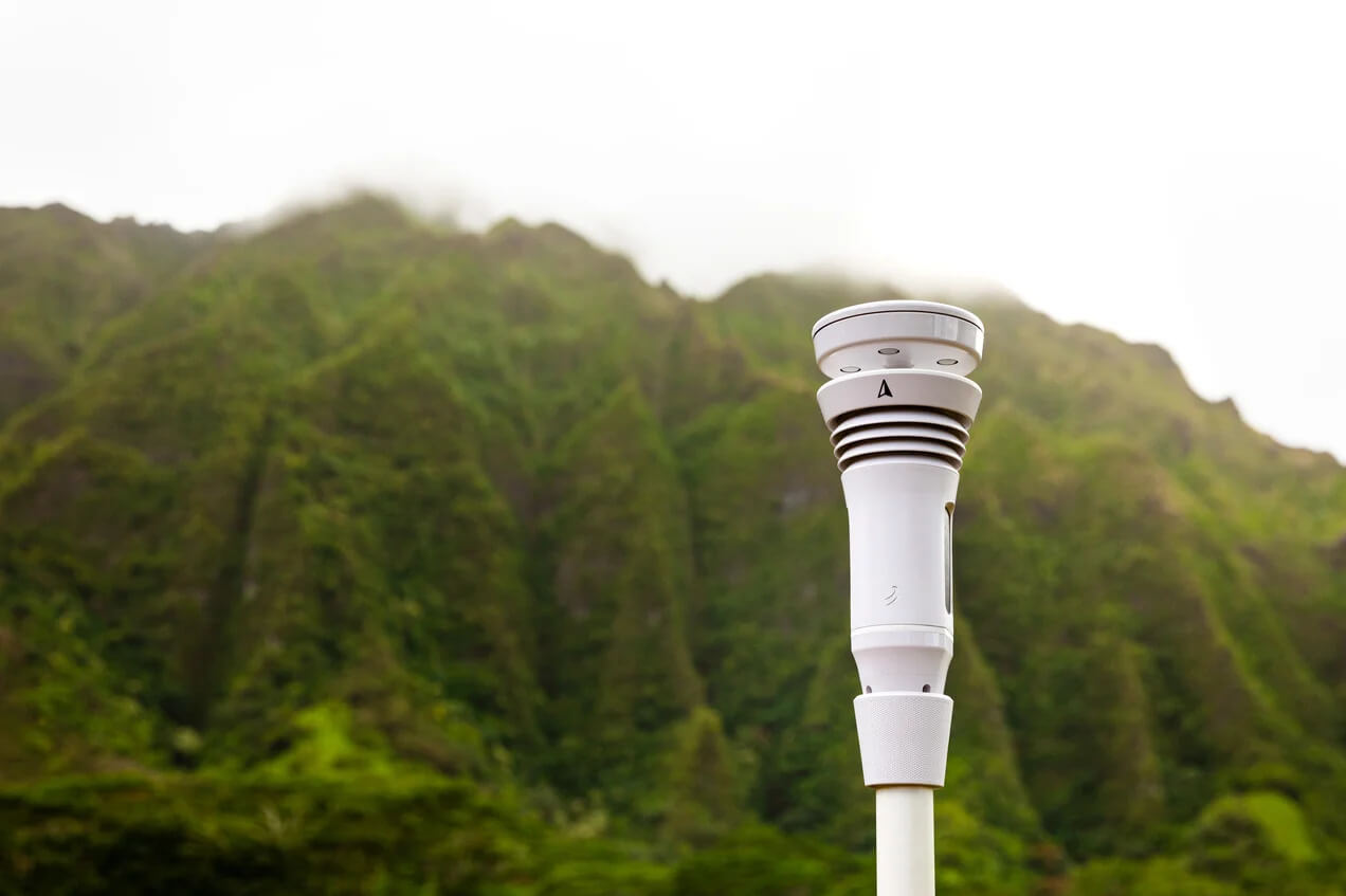 Tempest Weather System at the base of a green mountain