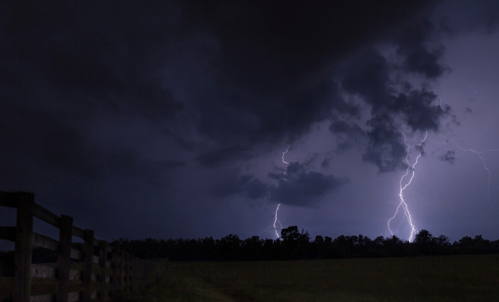 two lightning bolts striking the ground